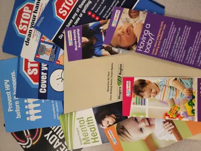 A stack of pamphlets for a clinic waiting room